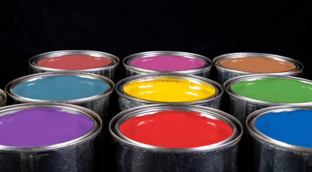 istock Multiple colours emulsion paint buckets isolated on black background 1416927086