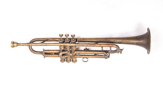 Close-up of an antique trumpet. The image shows partially a trumpet.