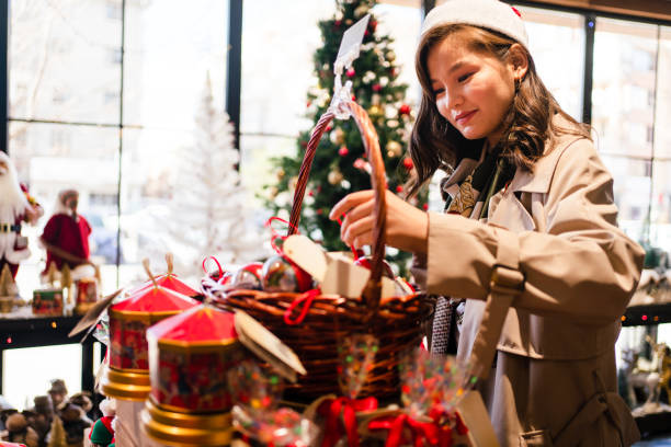 happy young woman  doing  shopping at  Christmas market stock photo