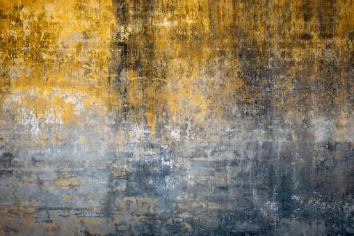 Yellow colored background. Damp wall. Badly damaged wall. Yellow worn background. Deteriorated wall. Empty yellow background. yellow background for commercial use.