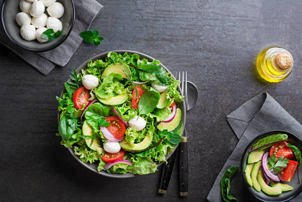 istock Green salad with avocado and mozzarella cheese 1416930532
