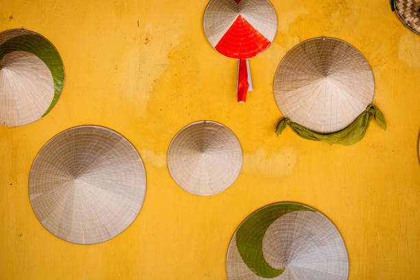 Wall with hanging Vietnamese hats.