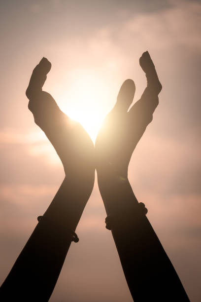 istock Hands reaching out to sky. 1416941397