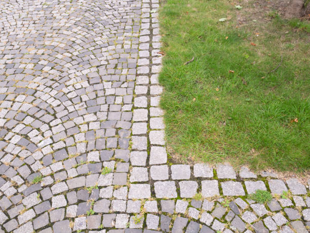 istock Cobblestone road in the park. 1416941424