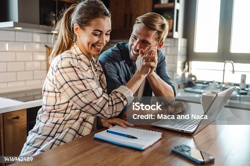 istock Happy family couple giving high- five to each other 1416942489