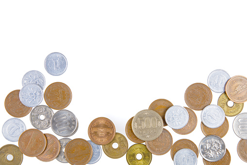 Stacks of new coins are isolated on a white background.  The stacks represent new money for investments. The coins are US pennies.  Empty space for text.