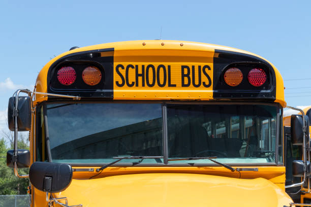 istock School Bus staging area waiting for students. School buses are an effective transportation method in rural districts. 1416942841