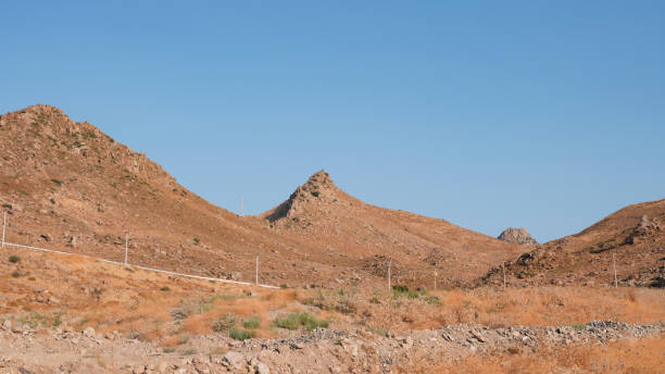 istock mountain landscape and electricity poles 1416943603