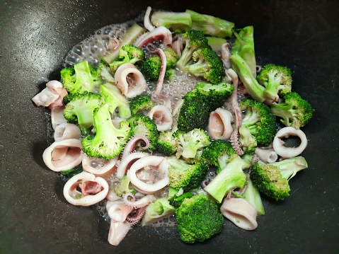 Cooking Stir fried Broccoli with Squid - food preparation.