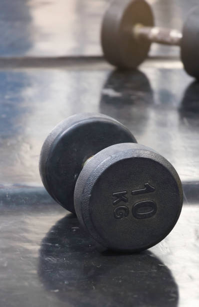 istock Dumbbell 10 kilograms put on rubber floor,equipment for weightlifting, 1416945540
