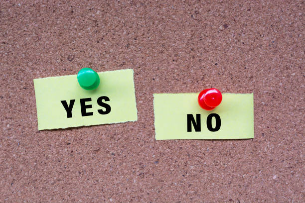 istock Yes No words on stick note and pinned to a cork notice board. 1416947131