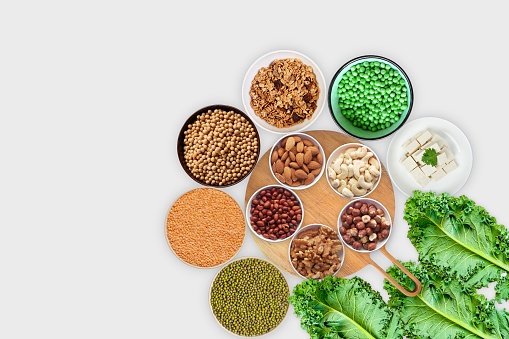 Vegan protein source. Legumes - lentils, chickpeas, beans, green mung bean, seeds and nuts on white background. plant based protein.
