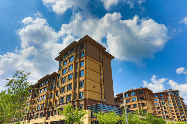 istock blue sky and white clouds color building 1416949322