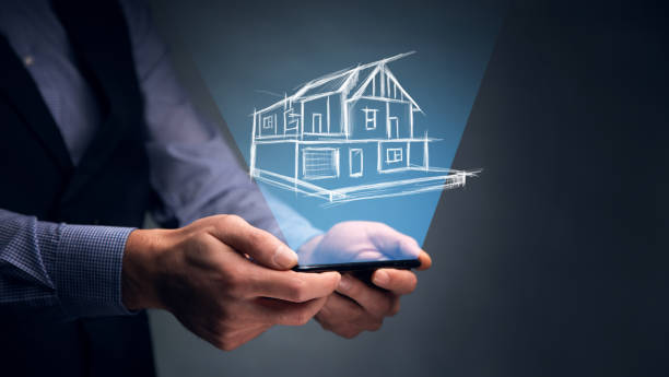 istock Businessman hold house icon.Smart home controlled 1416949680