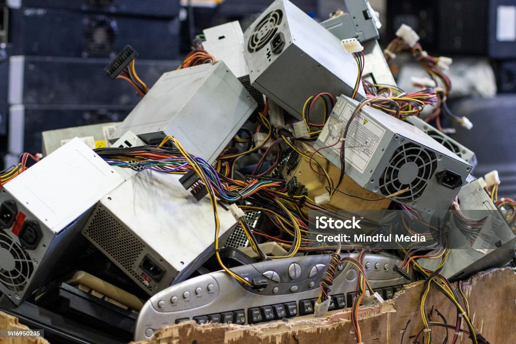 Old computer components in electronic recycling plant Front shot of old computer components in waste electronic recycling plant Label Stock Photo
