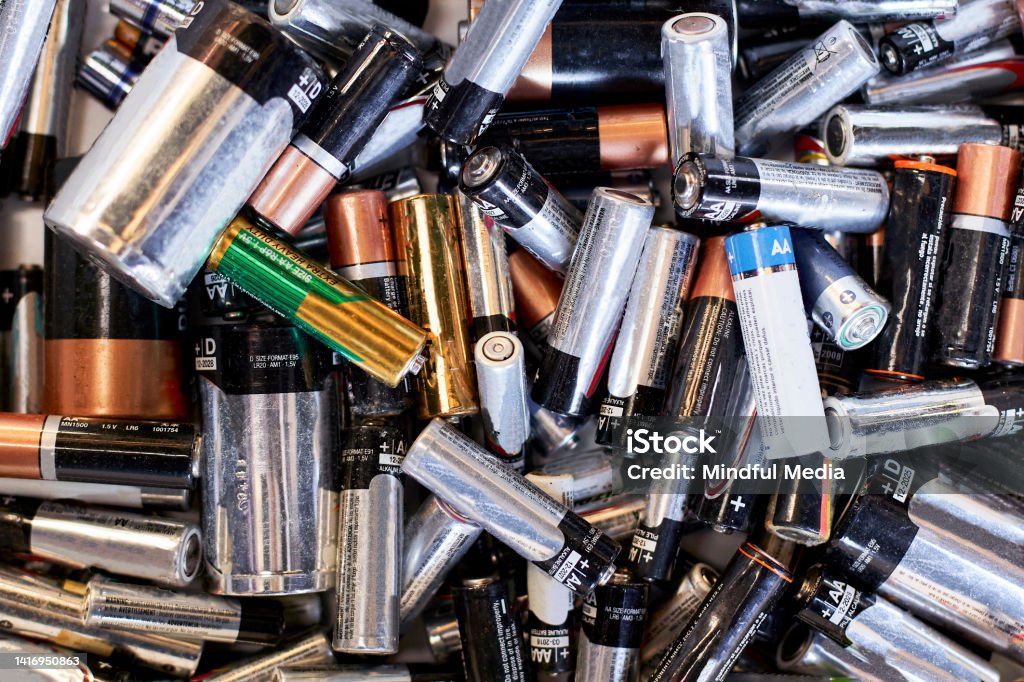 Pile of used batteries ready for recycling High angle view of piles of used batteries ready for recycling Battery Stock Photo