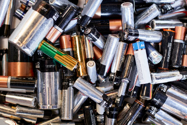 pile of used batteries ready for recycling - plastic chemical warehouse industry imagens e fotografias de stock