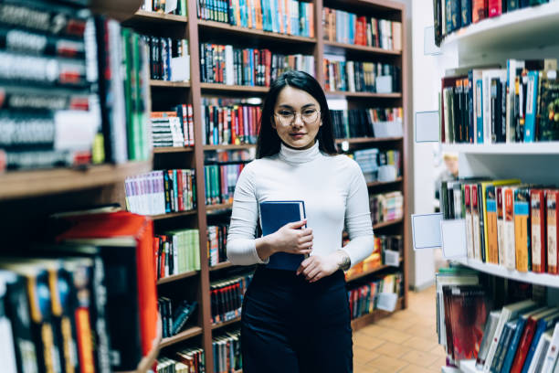 istock Asian female student studying in library 1416953081