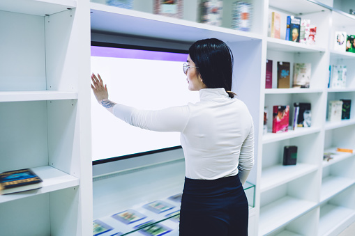 Student Using Touch Screen Female Student Using Touch Screen Interface In Library Stock Photo ...