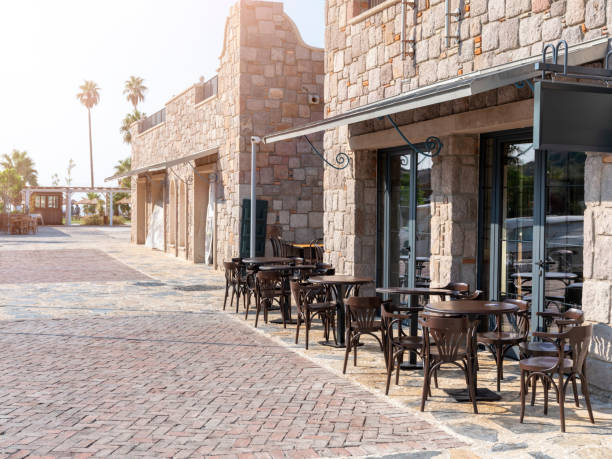 wooden table in front of coffee shop, frot view