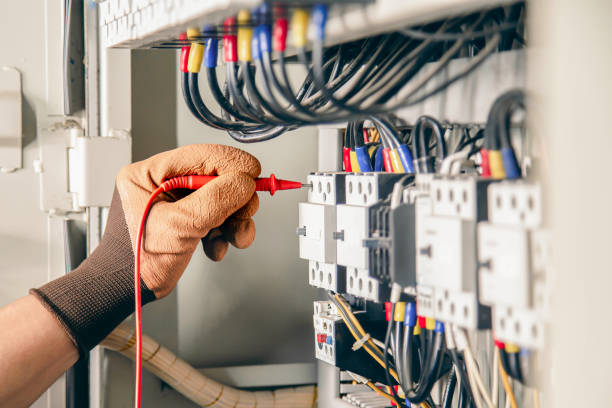 istock Electrical engineer checking the operation of electrical control cabinet, maintenance concept. 1416953864