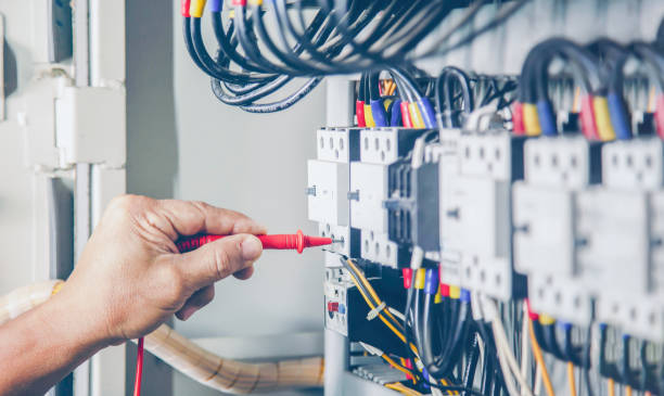 istock Electrical engineer checking the operation of electrical control cabinet, maintenance concept. 1416953883