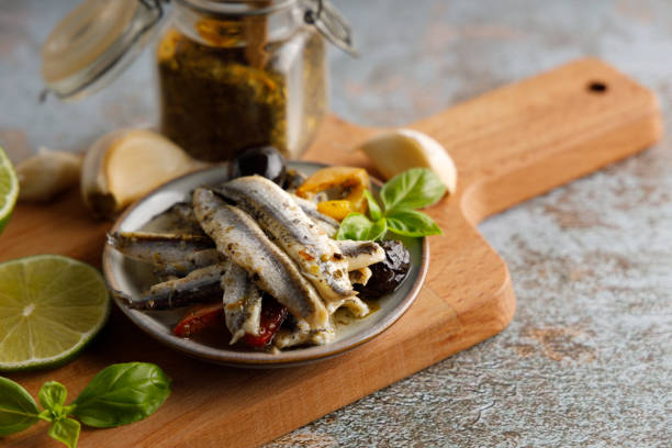 anchovy appetizer with olives. - caper sauce imagens e fotografias de stock