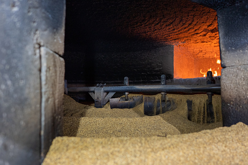 Roasted sesame seeds with wood in the stone oven in the sesame production center