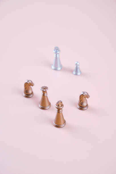 istock Gold and silver chess on a beige background. 1416957438