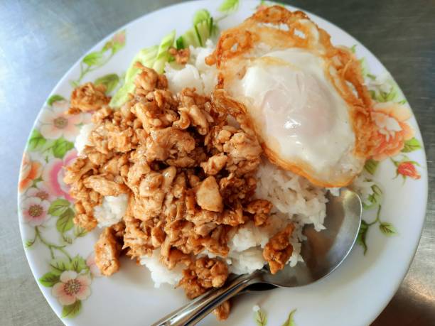 Chicken Garlic and fried egg on rice - Bangkok Street food. stock photo