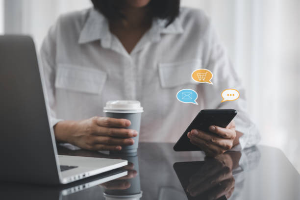 istock closeup woman hands using smart phone with message icon as chatting 1416962808