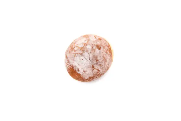 A delicious berliner (berliner donut), isolated on white background. A Berliner is a German donut with no center hole, made of sweet yeast dough fried in fat or oil, with a jam or marmalade filling such as a jelly donut, and usually icing, powdered sugar, or conventional sugar on top.