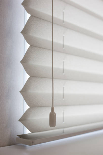 istock Pleated blinds close up on the window in the interior 1416987196