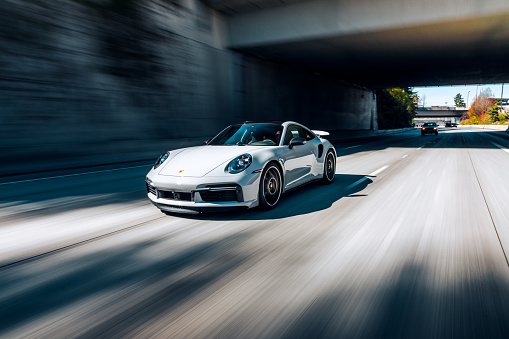 Seattle, WA, USA\n8/20/2022\nPorsche 911 Turbo S driving on the highway with no other cars around