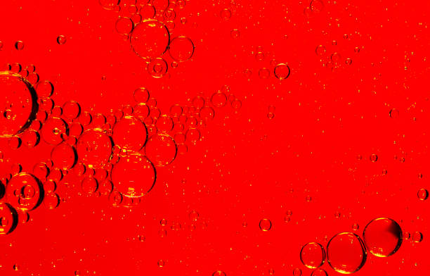 istock Red macro bubbles,Backgrounds, Abstract Backgrounds, Soda, Red, Carbonated,Beauty concept background. Closeup cosmetic liquid gel with bubbles on red colors background 1416994655
