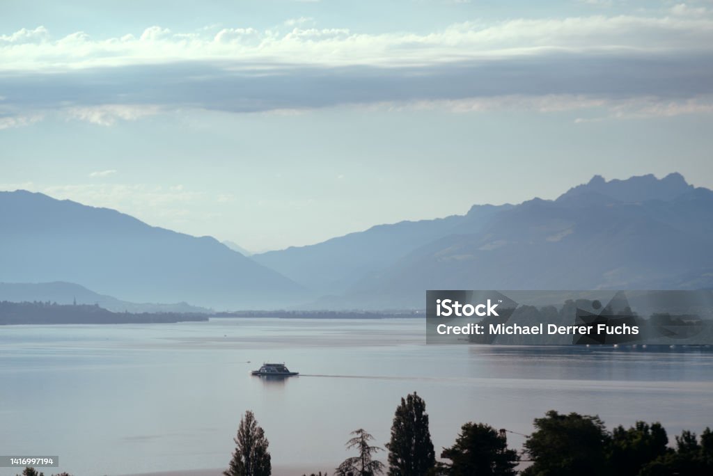 Car ferry between cities of Horgen and Meilen on Lake Zürich o a blue cloudy summer morning. Photo taken July 3rd, 2022, Lake Zurich, Switzerland. Blue Stock Photo
