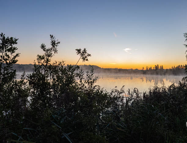 istock The moon over the river at sunset 1416998608