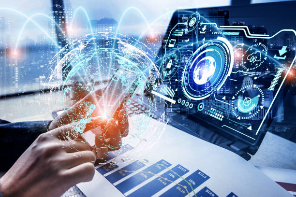 istock businessman using laptop computer sending and download digital data info with blur city night. 1417000991