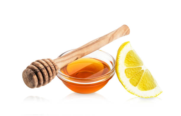 istock Lemon and honey isolated on white background. 1417003935