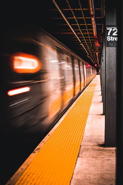 istock New York City Subway train speeds away from the platform 1417012806