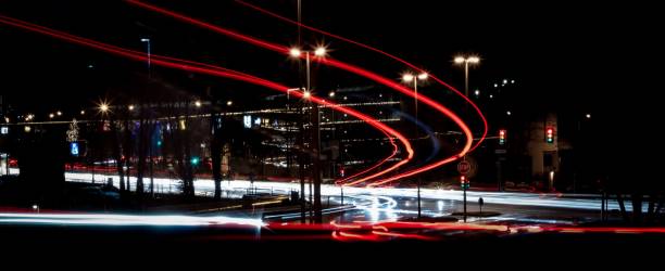 istock Light exposure of vehicles running on road 1417013978
