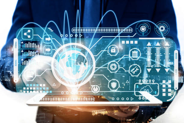 istock double exposure of businessman using tablet computer sending and download digital data info with blur city night. 1417015039