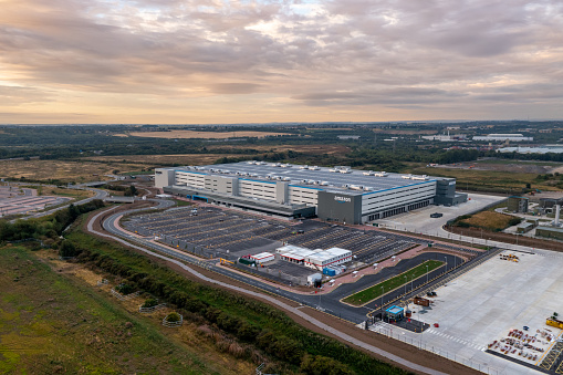 Leeds, UK - August 22, 2022. Aerial view of a large Amazon Prime distribution warehouse at Gateway 45 near the M1 motorway in Leeds, UK