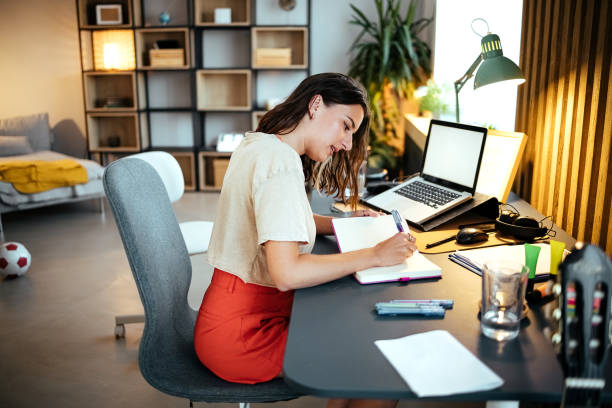 istock Woman working at home 1417016117