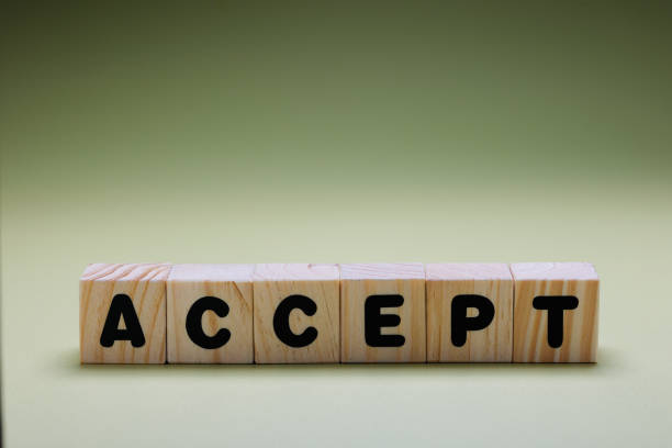 istock ACCEPT word on wooden cubes 1417017421