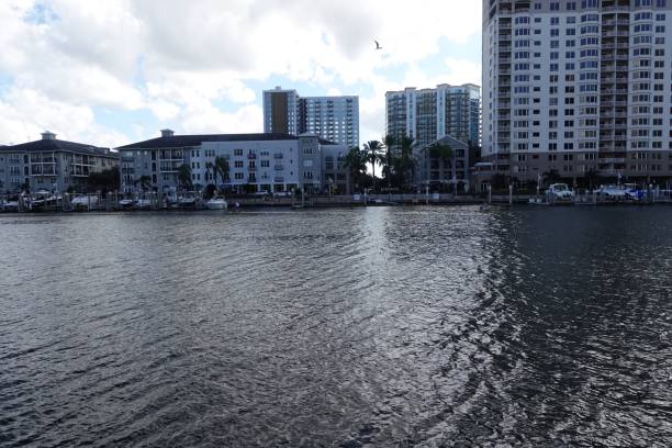 istock Riverside view of buildings along water under a blue cliudy sky 1417021014