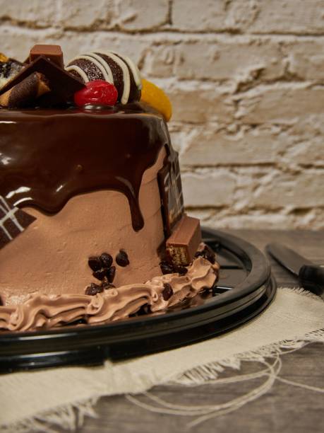 istock chocolate cake with cherry and peach chocolates decoration 1417021390