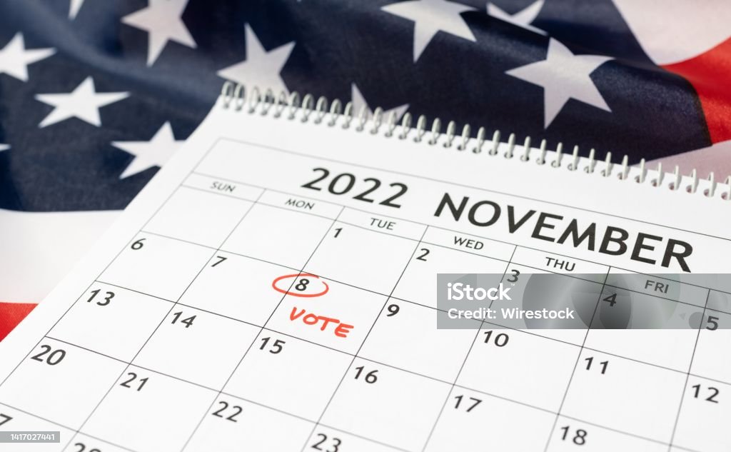 Vote day concept November 2022 Desk calendar with November 8 2022 marked in red on USA flag background. Vote day concept Election Stock Photo
