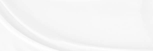 istock White gray satin texture that is white silver fabric silk panoramic background with beautiful soft blur pattern natural. 1417031012