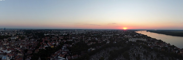 A panoramic view of the cityscape and river of Belgrade Zemun in Serbia during sunset